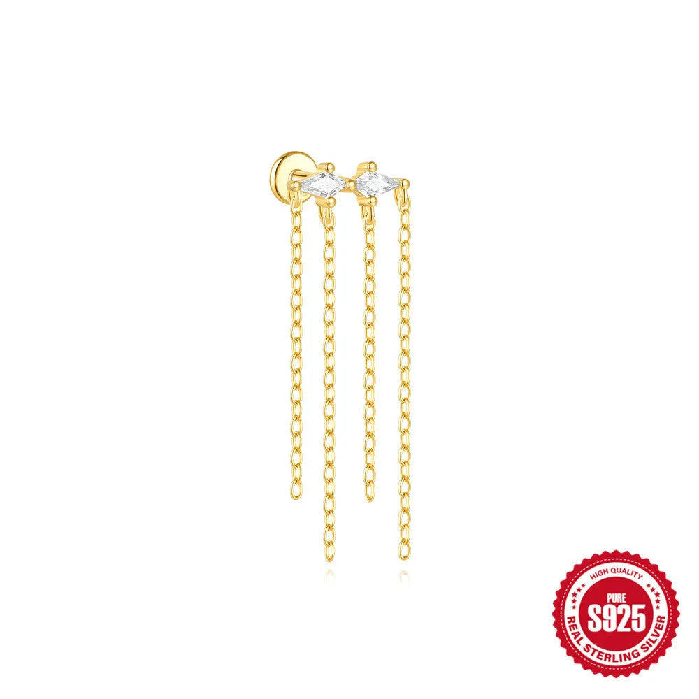 Geometric kite-shaped sterling silver stud earrings with rhinestones and a gold chain tassel.