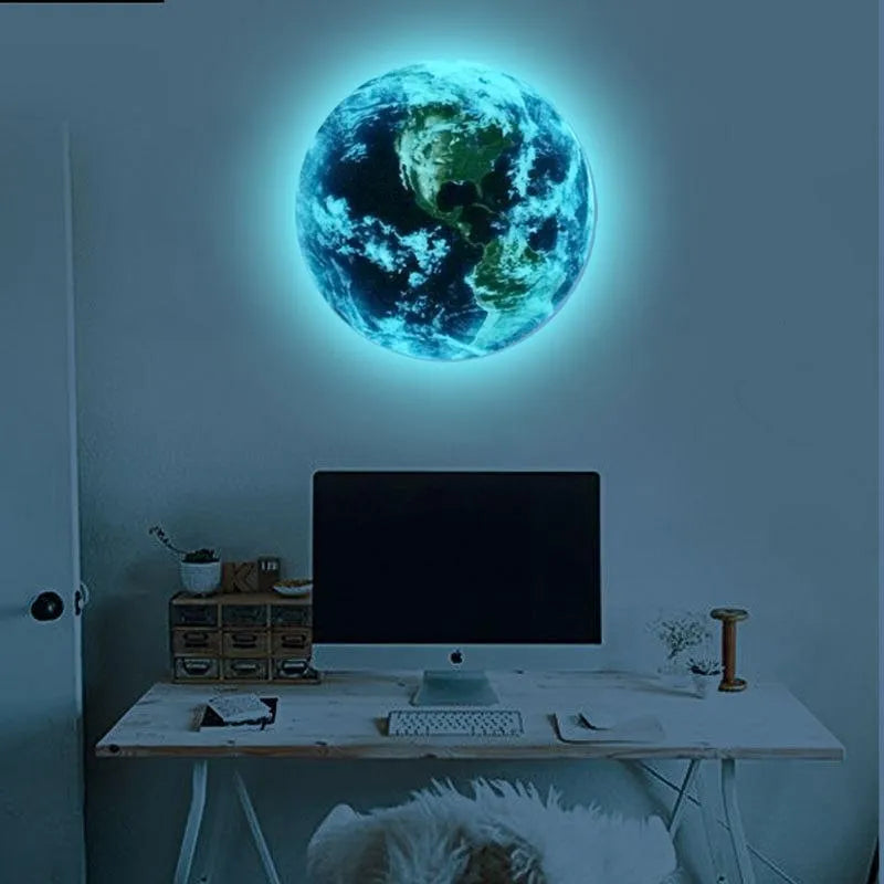 Glow in the dark 3D planet Earth wall sticker on a dark blue background, showing its luminous effect.