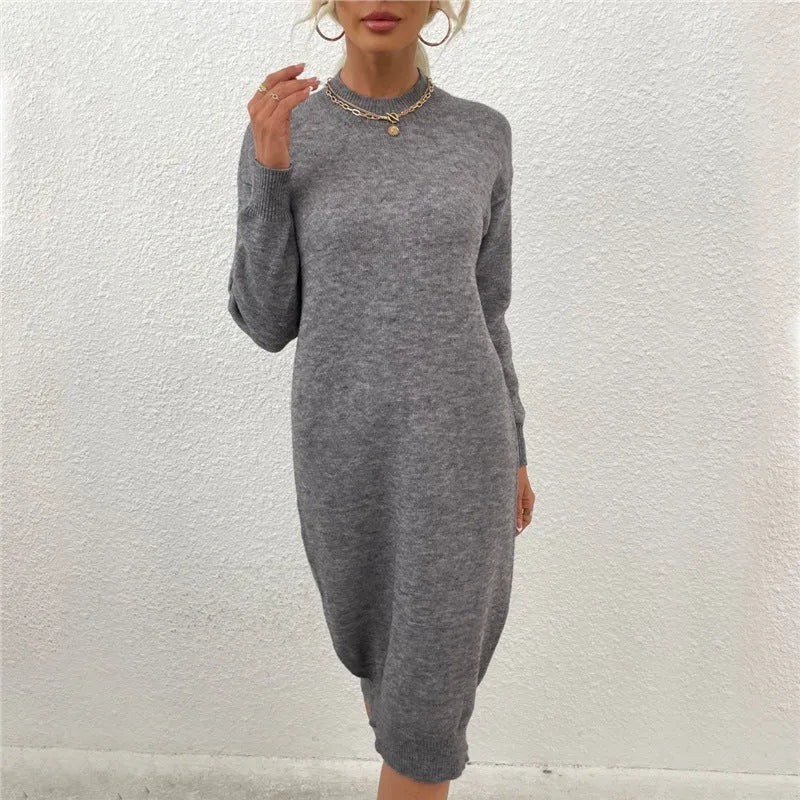Women's grey crew neck acrylic sweater pullover with long sleeves on hanger