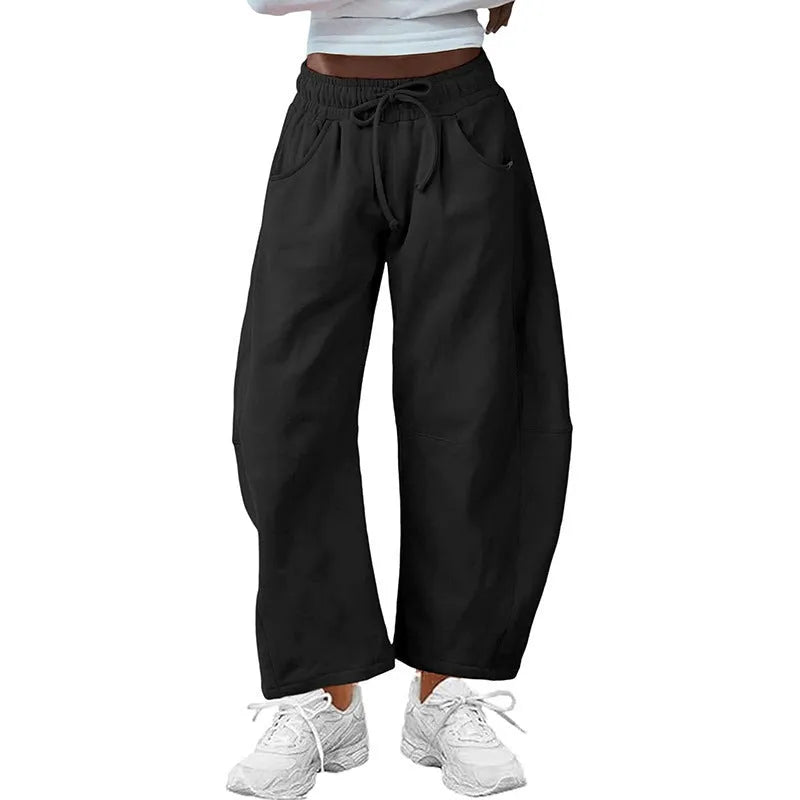 Women's loose cropped sweatpants with drawstring elastic waist and side pockets in street fashion style