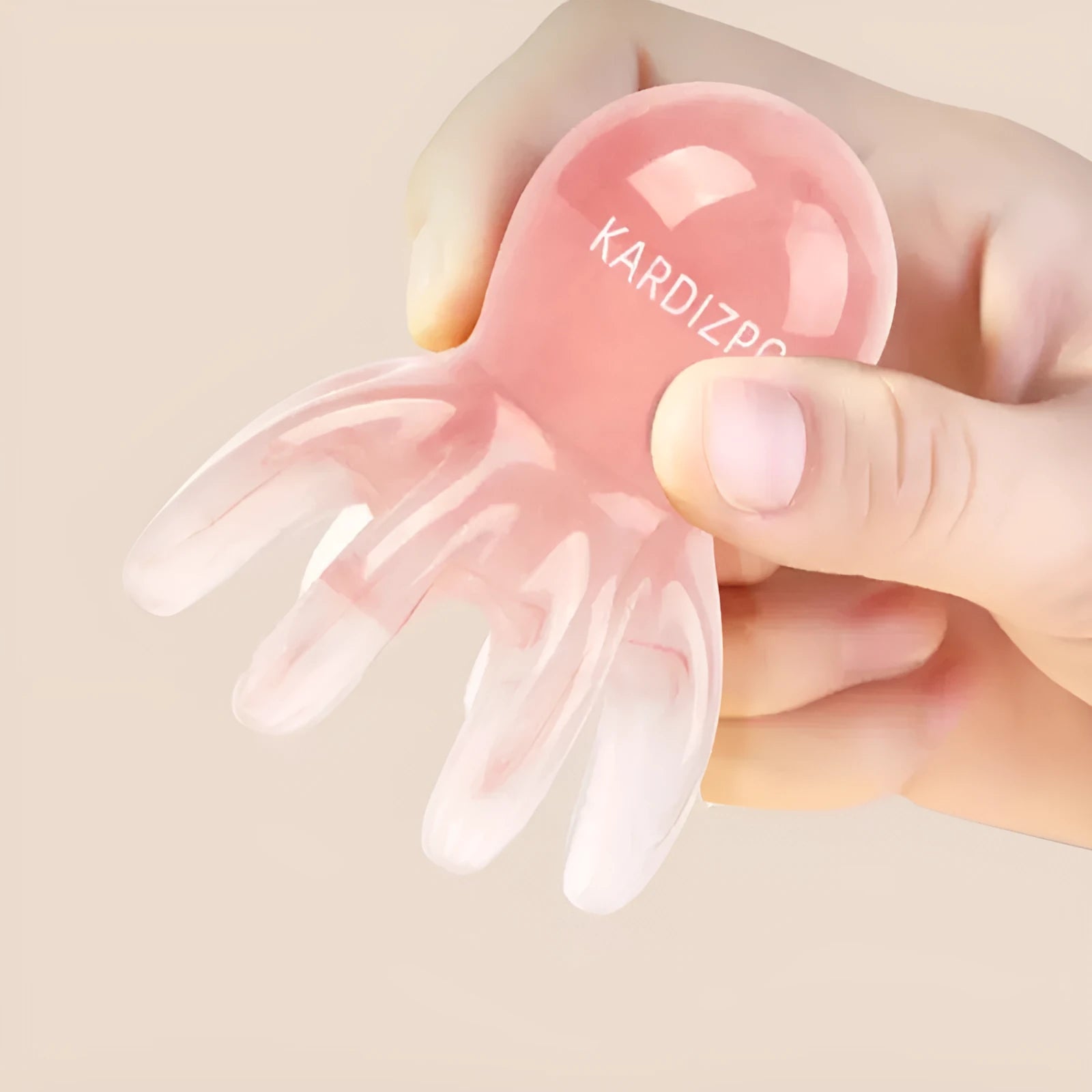 Small pink octopus-shaped massage comb for periocular meridian massage with natural resin material
