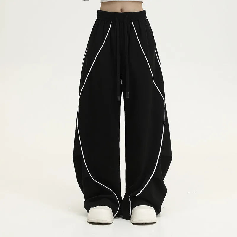 Black pleated hip hop trousers with wide legs and striped pattern