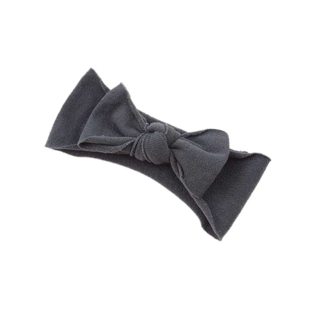 Solid colour knotted cloth headband for baby girls with bowknot design, available in 37 colours