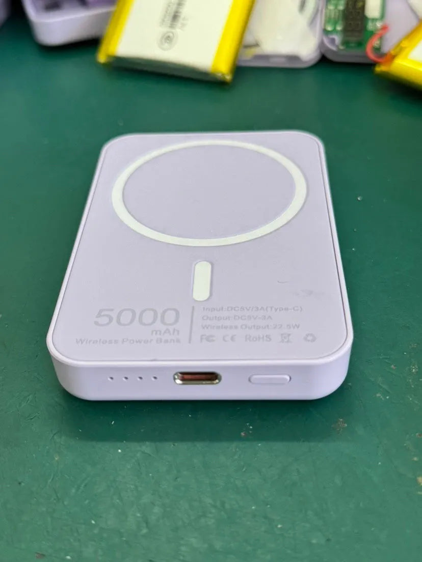 Magnetic wireless charging power bank in white with creative foot design showing charging surface