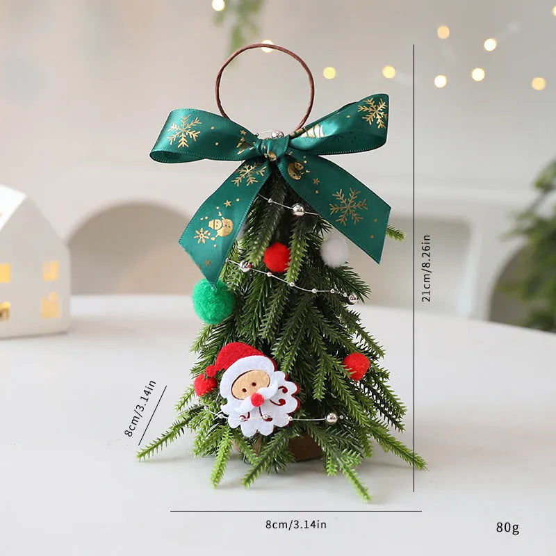 Mini Christmas tree ornament in red and white snowflake design on a tree branch
