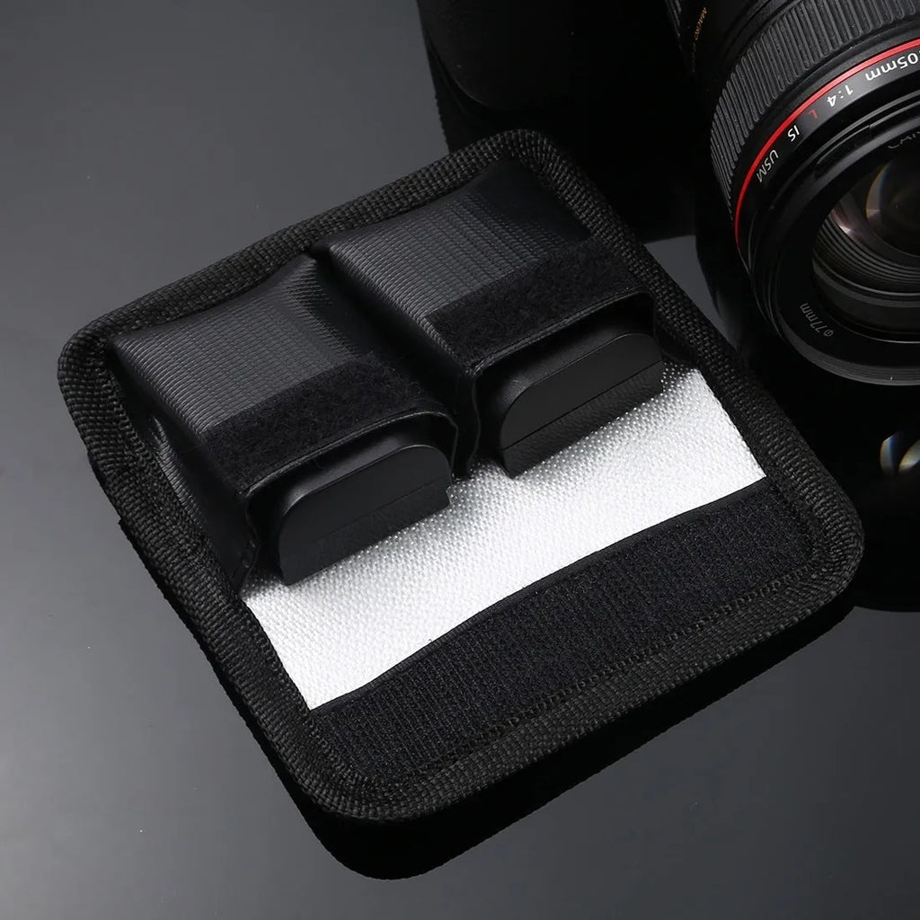 Black explosion-proof lithium battery storage bag with magic tape closure on a white background