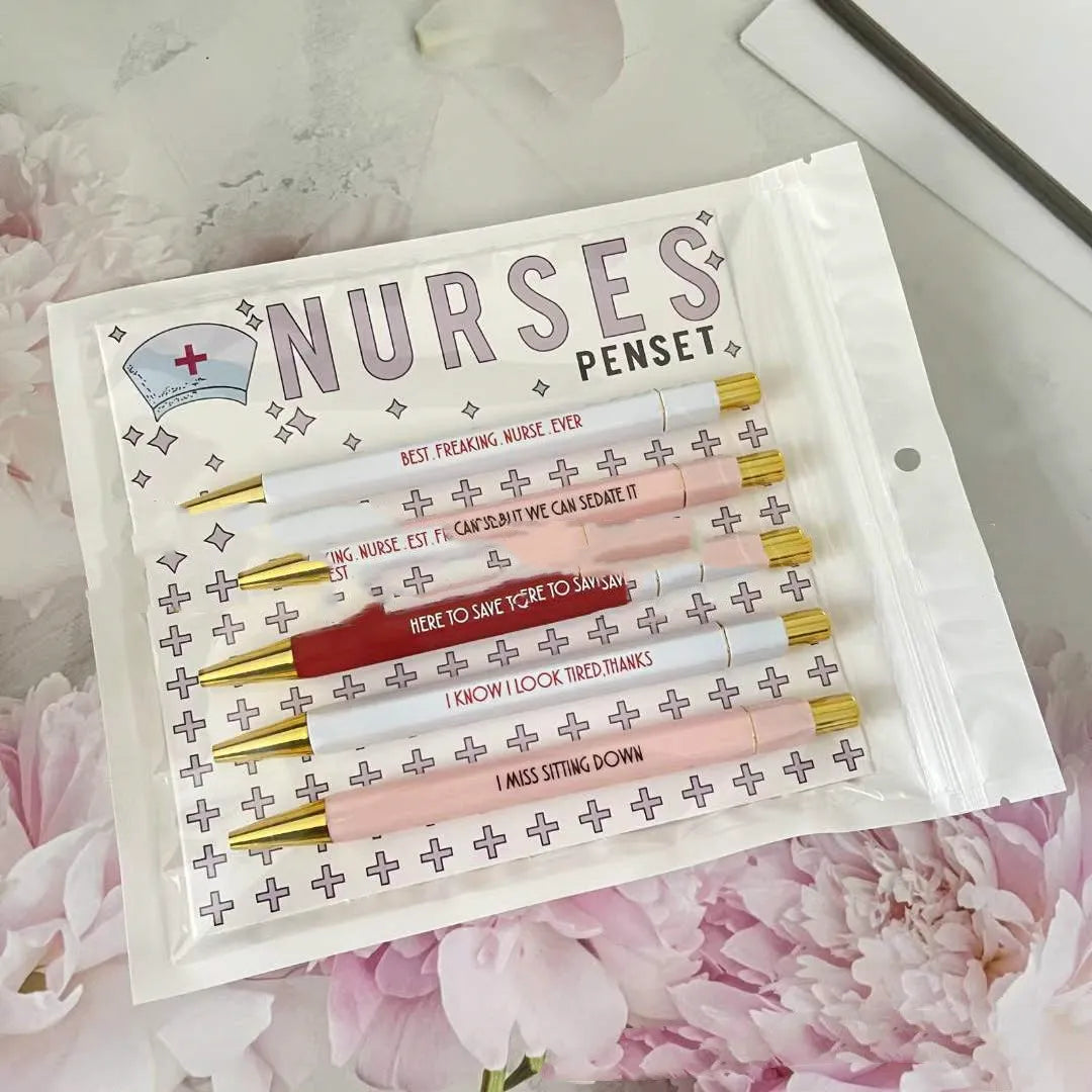 Set of five nurse-themed retractable ballpoint pens with medical designs showing plastic construction