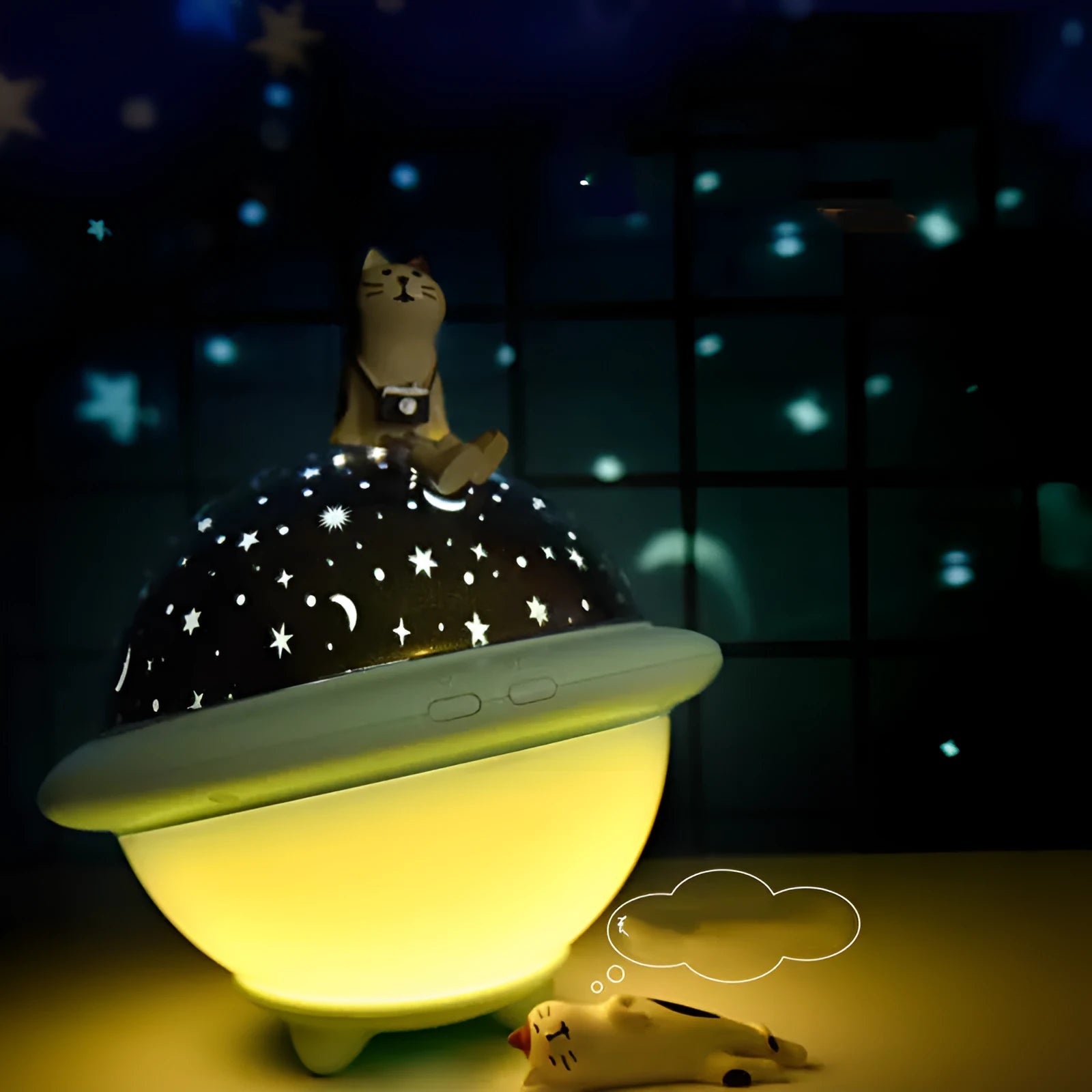 Green UFO shaped LED night light projecting starry sky pattern on ceiling