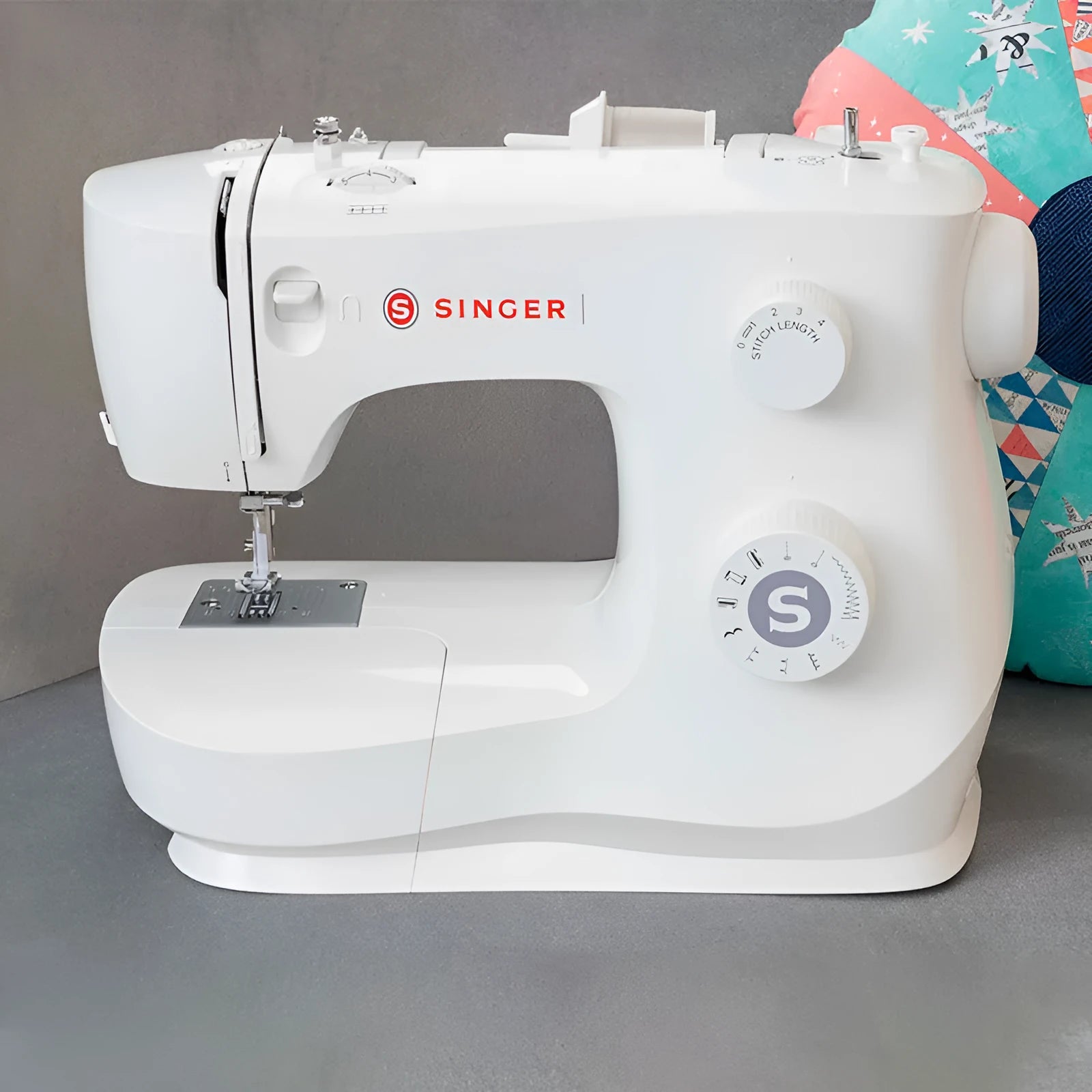 M2405 portable sewing machine with accessories on tabletop
