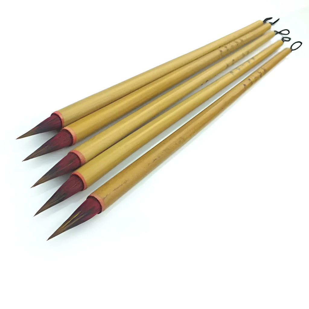 Small red writing brush with mixed sheep and wolf hair bristles on wooden handle