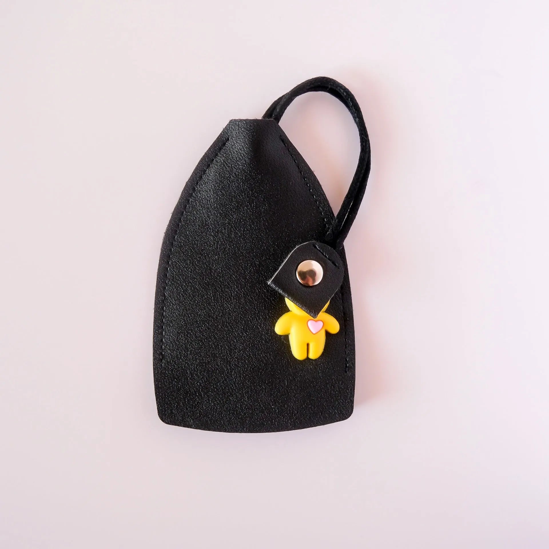 Black PU leather universal car key case with large capacity and anti-theft storage.