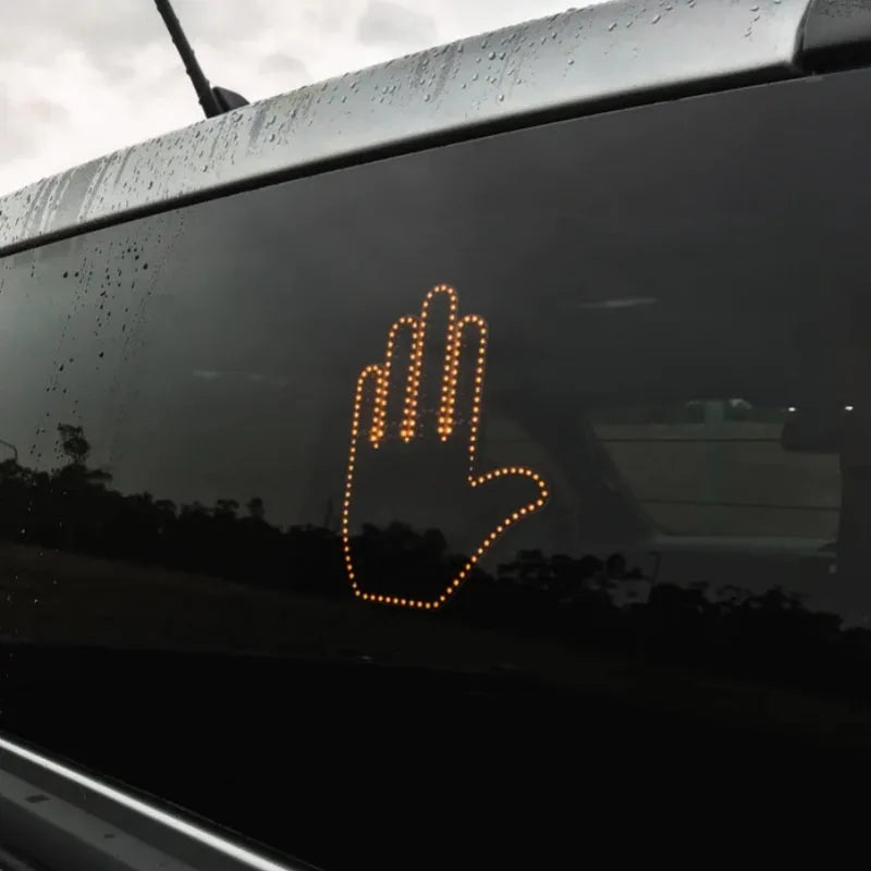 Black plastic car gesture light with LED illuminated hand gestures and remote control