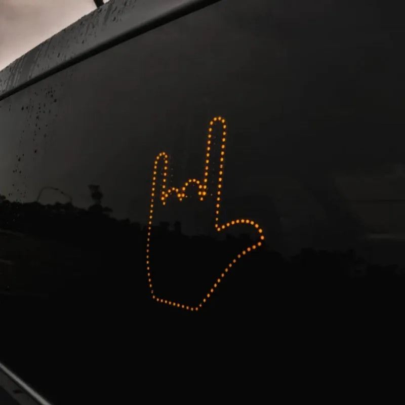 Black plastic car gesture light with LED illuminated hand gestures and remote control