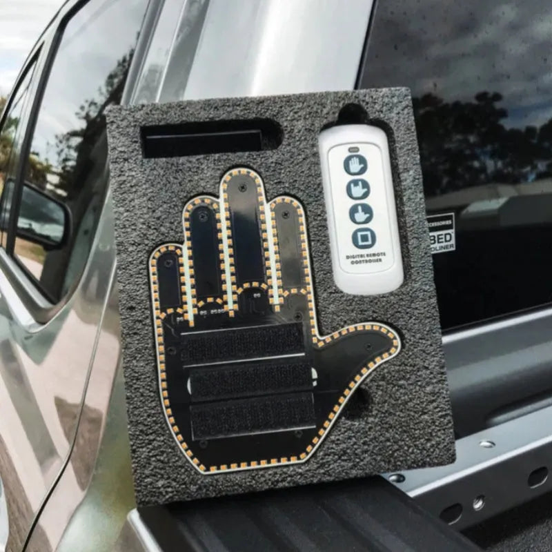 Black plastic car gesture light with LED illuminated hand gestures and remote control