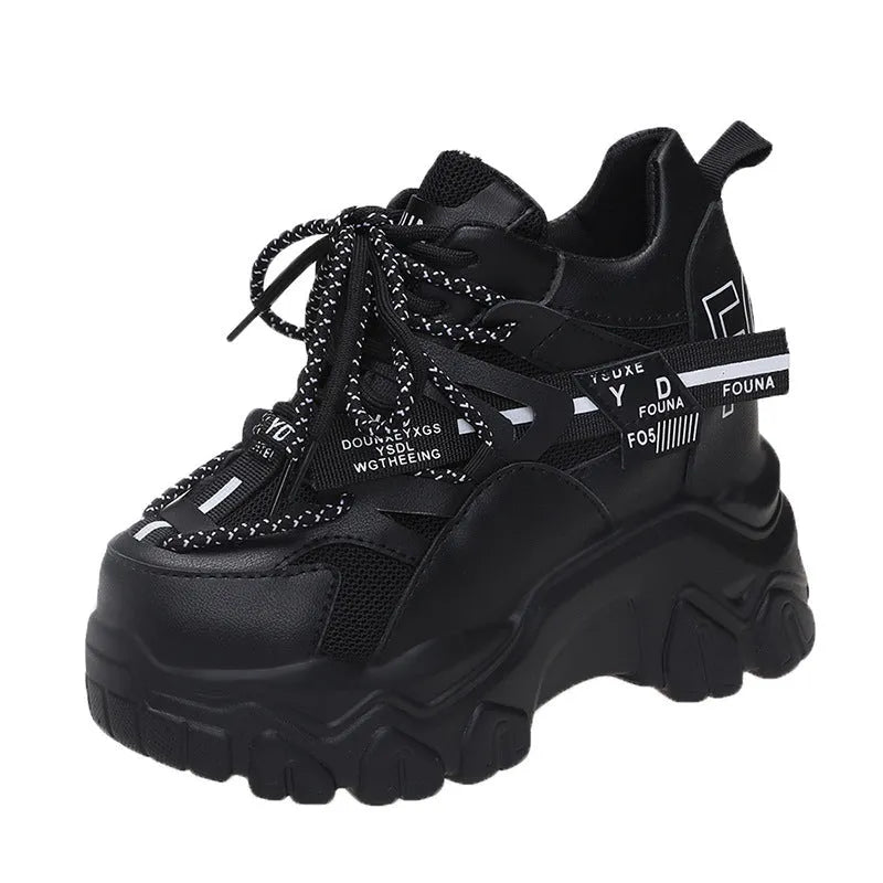Women's white mesh platform sports shoes with cross strap and a high rubber sole.