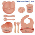 Children's silicone tableware set with cat ear cup in beige, blue and other colours on a table