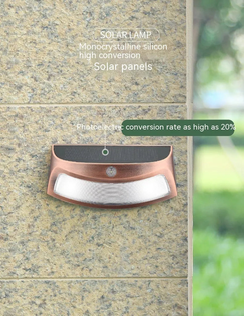 Solar outdoor wall light with smiling face design and IP65 waterproof rating