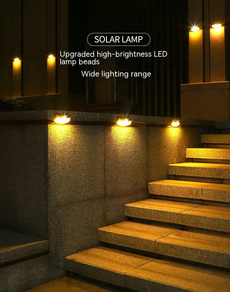Solar outdoor wall light with smiling face design and IP65 waterproof rating