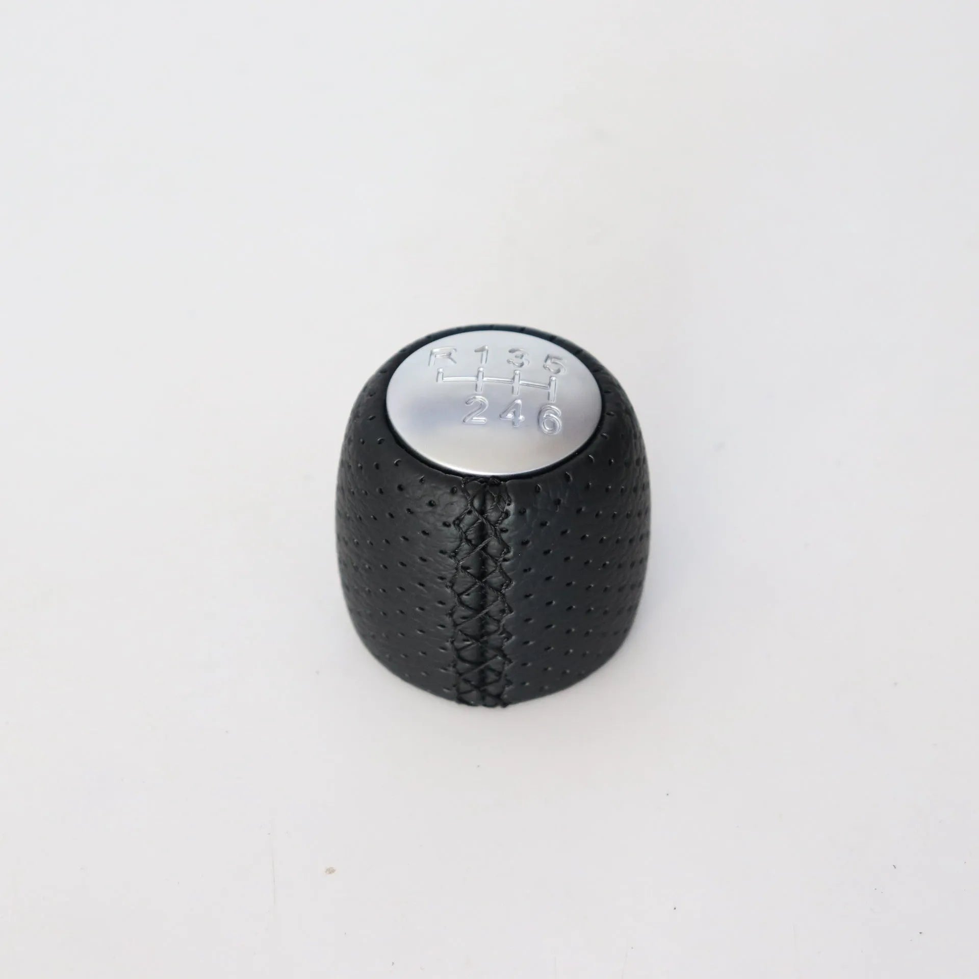 Sewn wrapped perforated PU leather handball gear for Alpha vehicles in black, red, or white.