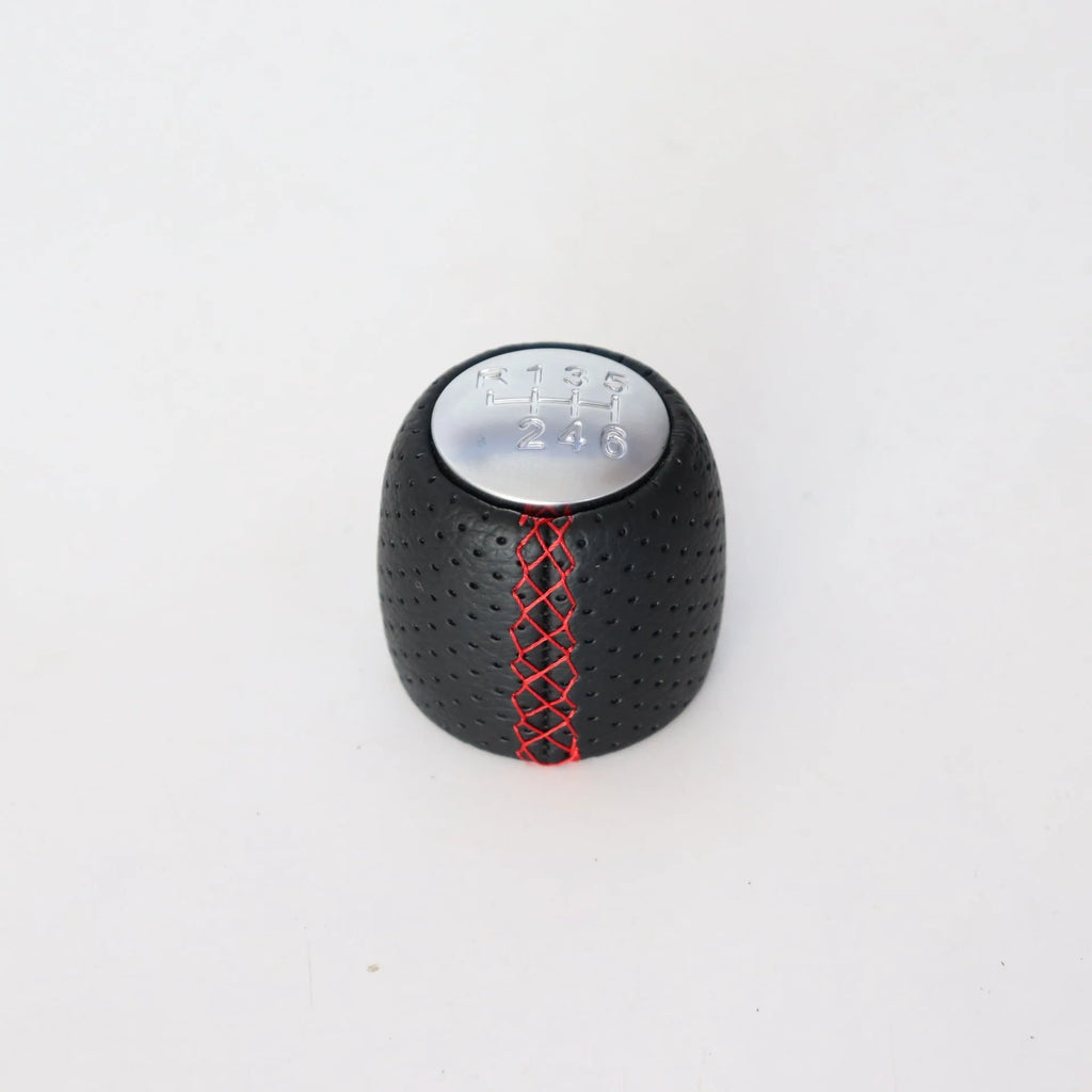 Sewn wrapped perforated PU leather handball gear for Alpha vehicles in black, red, or white.
