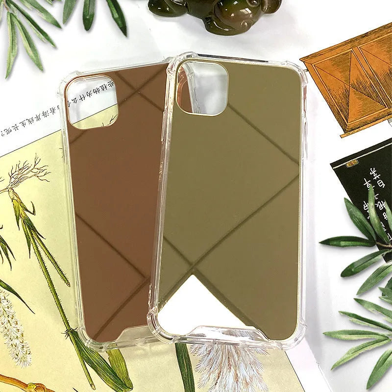 Silver mirror finish hard PC phone case for Apple iPhone on a table.