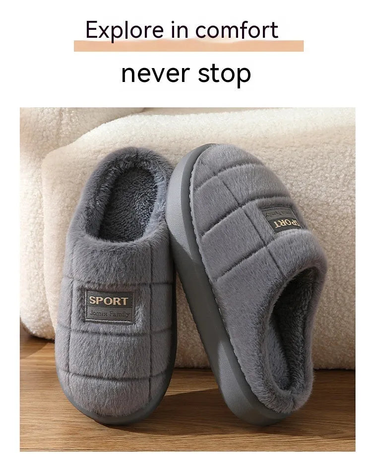 Men's grey thick-soled winter slippers with rabbit hair upper and textured sole.