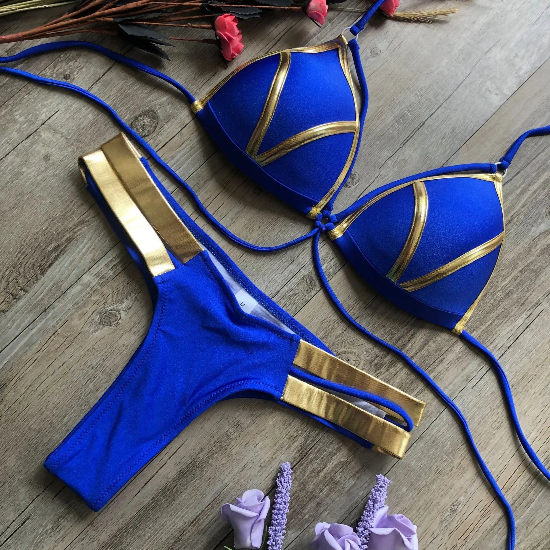 Women's bronzing bikini swimsuit with padded cups and cotton lining in multiple colour and print options.