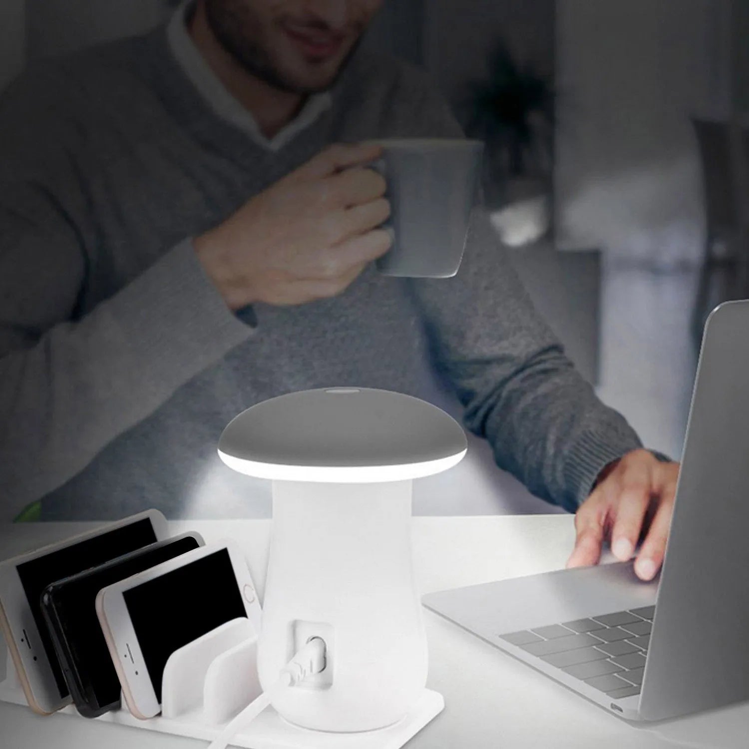 White mushroom-shaped LED desk lamp with 5 USB charging ports at its base on a wooden table.
