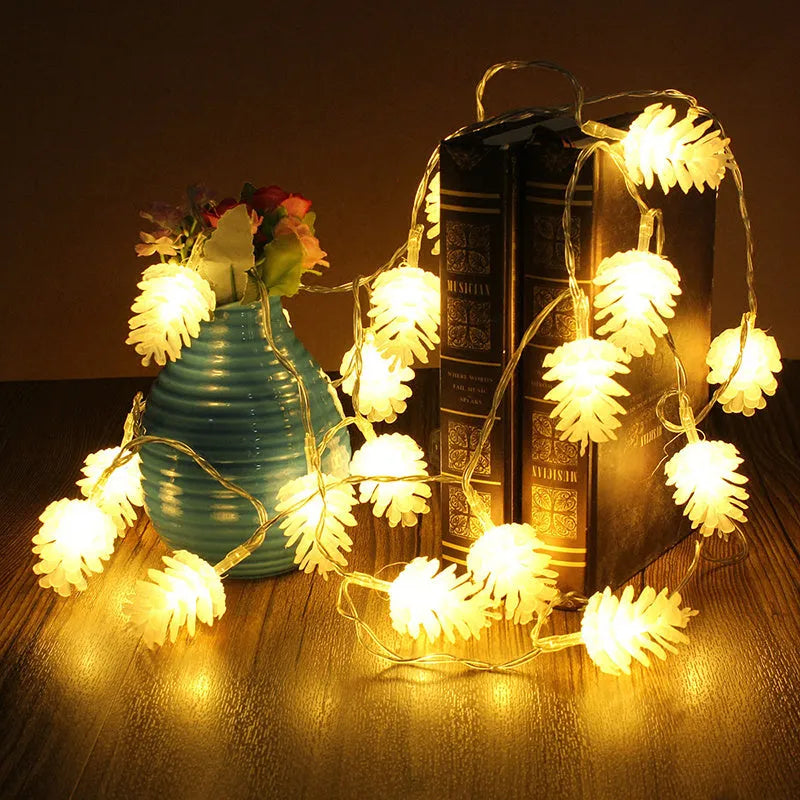 LED pine cone light string with plastic shell housing in warm white colour