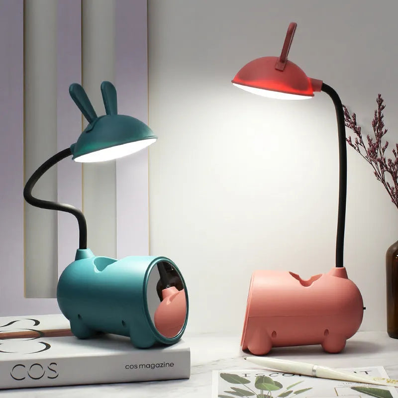 Cartoon-style USB desk lamp with pen container in green, dark blue or pink colour options