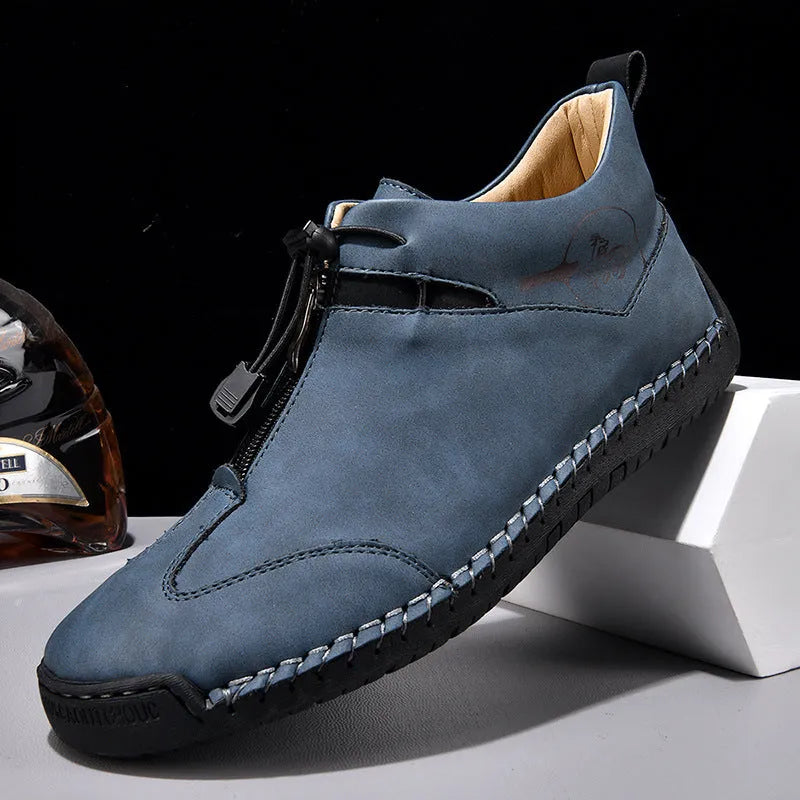 Men's black casual leather shoes with round toe and mid heel on a rubber sole