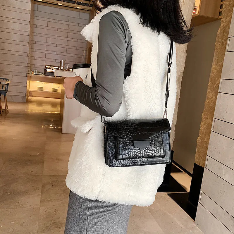 Vintage-style black PU leather crossbody bag with adjustable strap