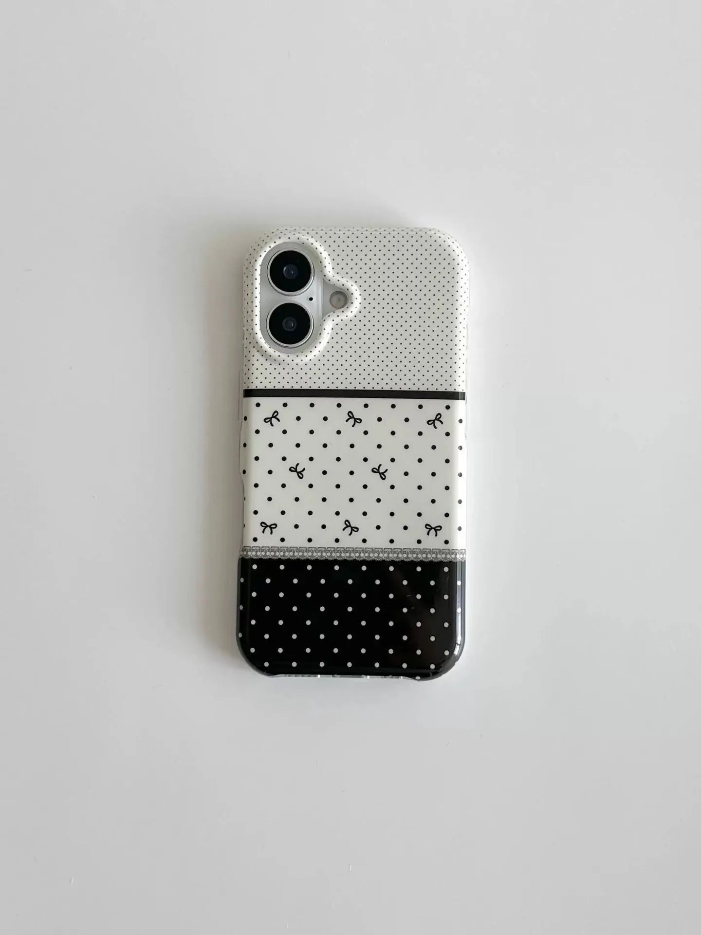 Black and white polka dot stitching stereo bow silicone phone case for iPhone