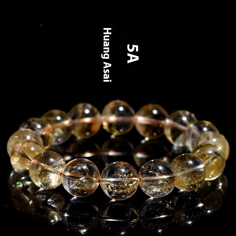 Natural yellow citrine gemstone bracelet showing geometric beads on a string.
