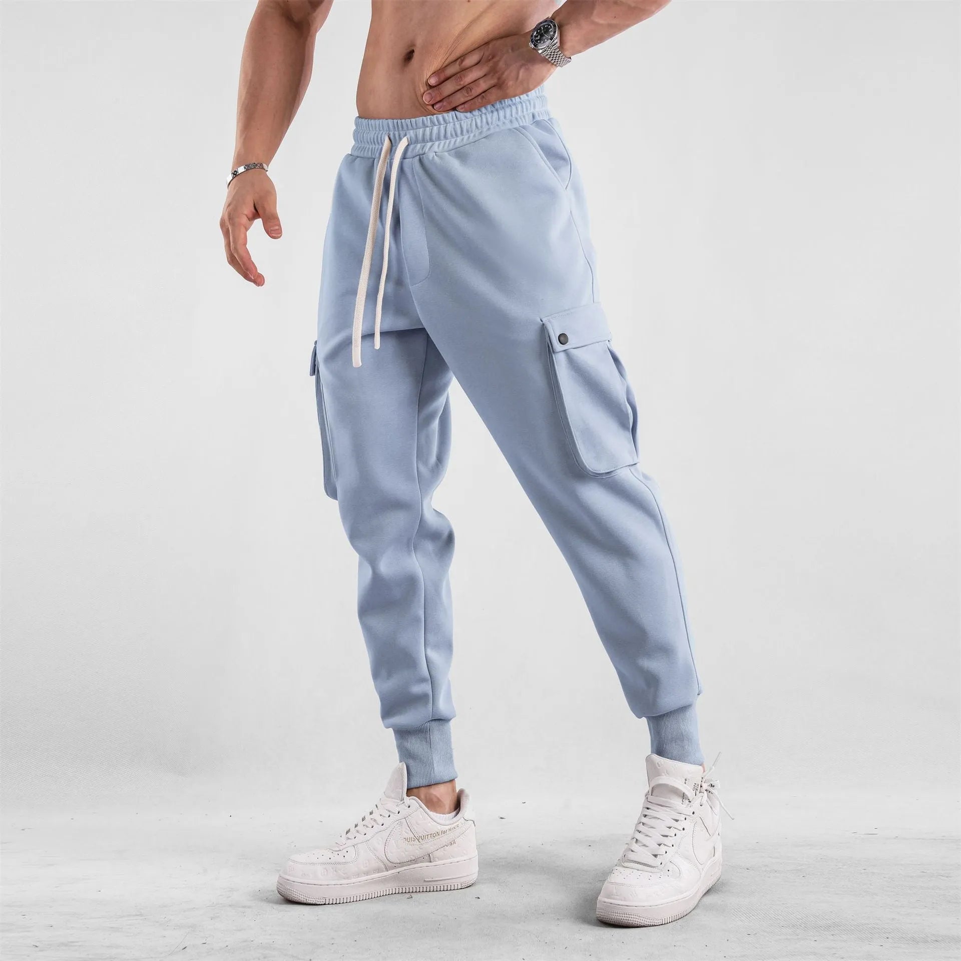 Men's loose cotton sports trousers with ankle ties and multiple pockets in various colour options