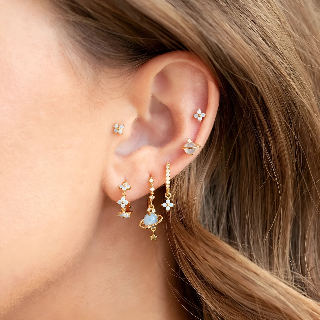 Gold and silver floral stud earrings with blue protein stone mosaic design.