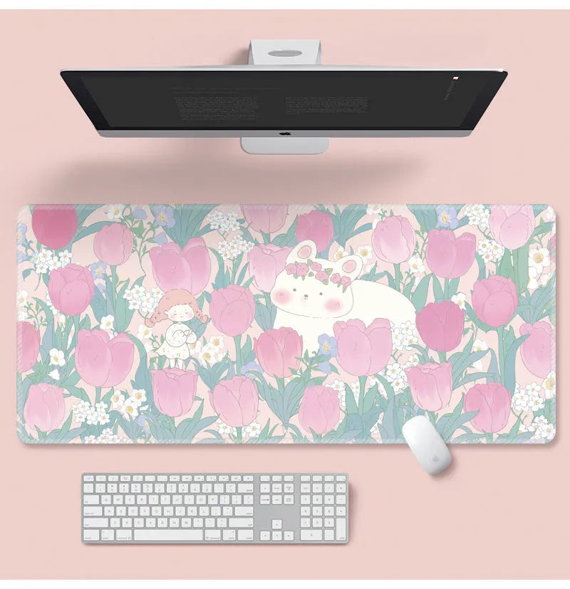 Large floral pattern mouse pad on a desk with keyboard and mouse, showing non-slip rubber base.