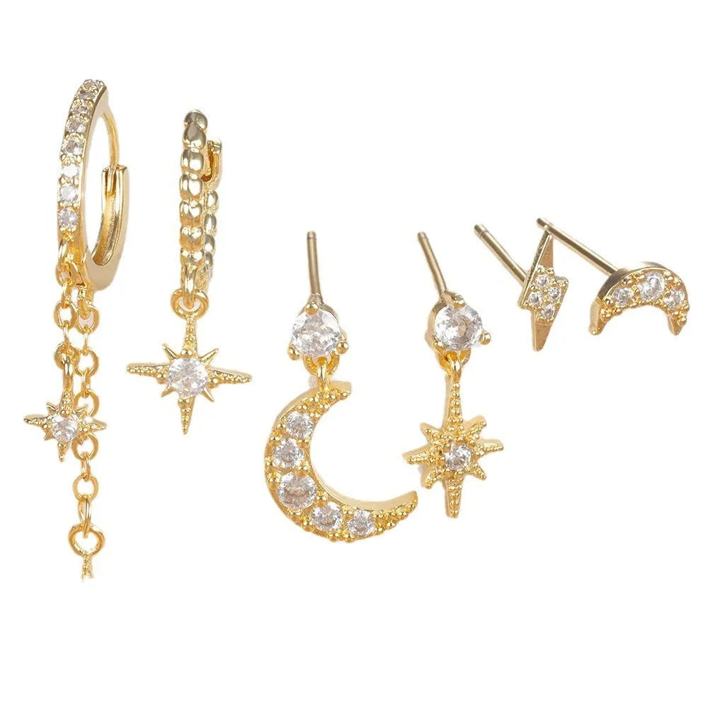 Six pairs of gold chain tassel earrings with zircon studs in display layout