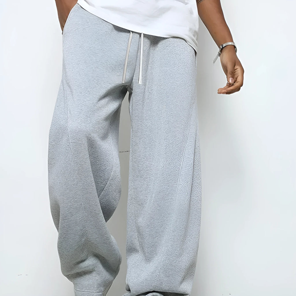 Men's straight leg casual trousers in black, dark grey and light grey colours with a drawstring waist.