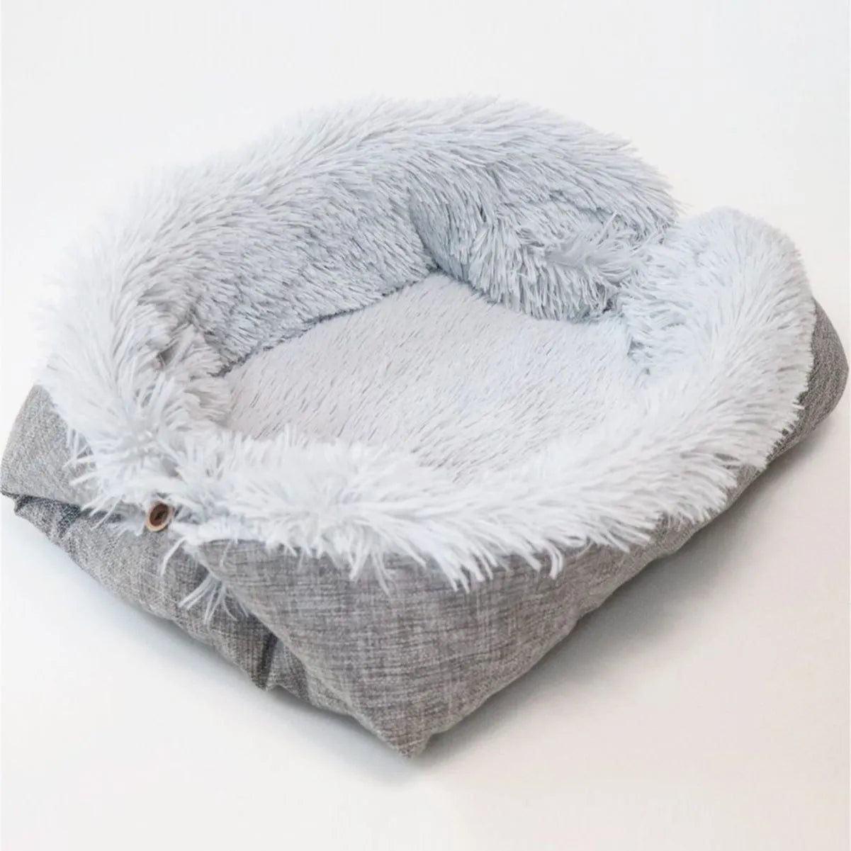 Grey or white pet blanket with long plush hair measuring 61cm by 51cm with non-slip black bottom