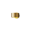 Modern copper wall light fixture in gold finish mounted on a wall