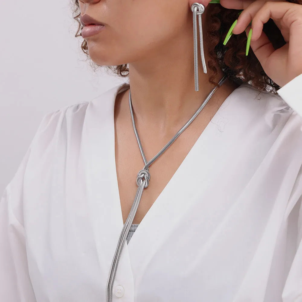 Gold knotted tassel necklace and matching earrings set on titanium steel snake chain
