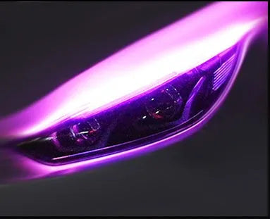 Flexible silicone car LED daytime running light strip with flowing turn signal functionality mounted on vehicle headlight