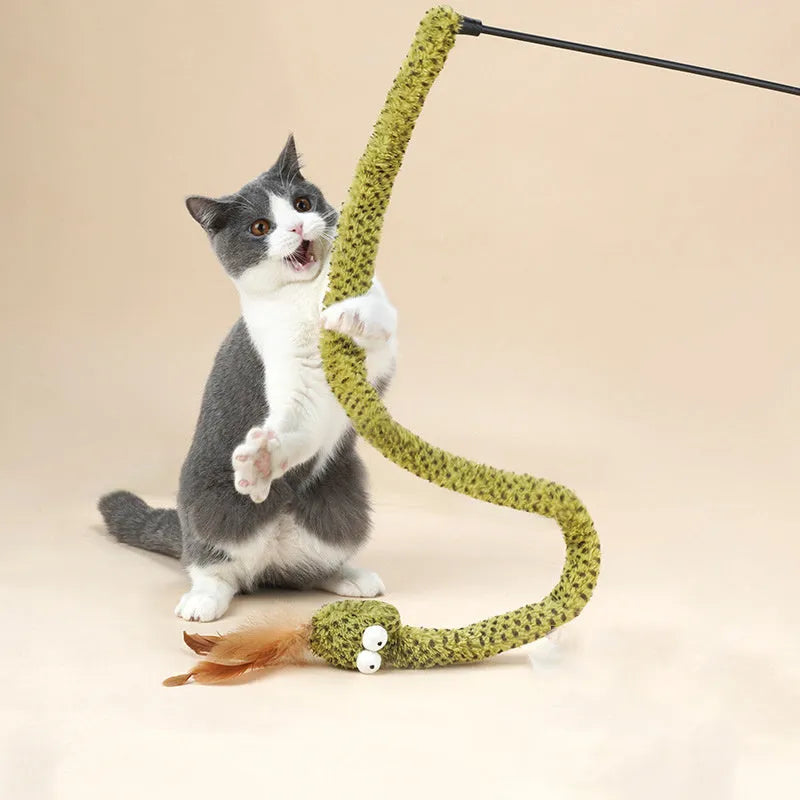Green cat teasing stick with long pole showing artificial snake and feather attachments for interactive play