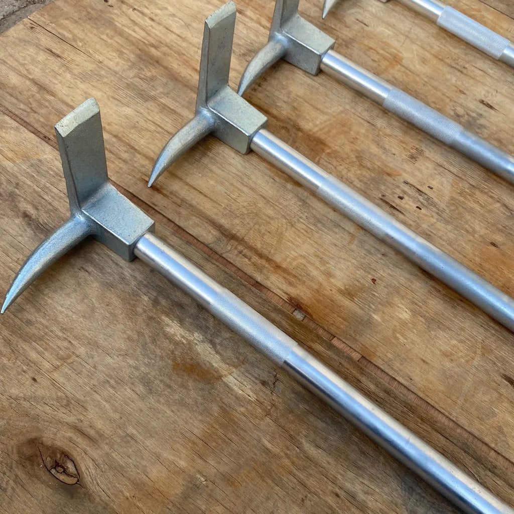 Silver carbon steel wrecking bar 24 inches with iron collar on a dark surface
