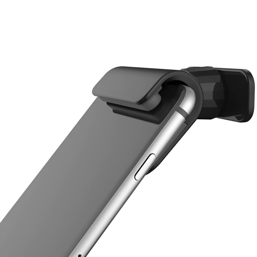Black gravity car phone holder with 360-degree rotating head mounted on a car dashboard