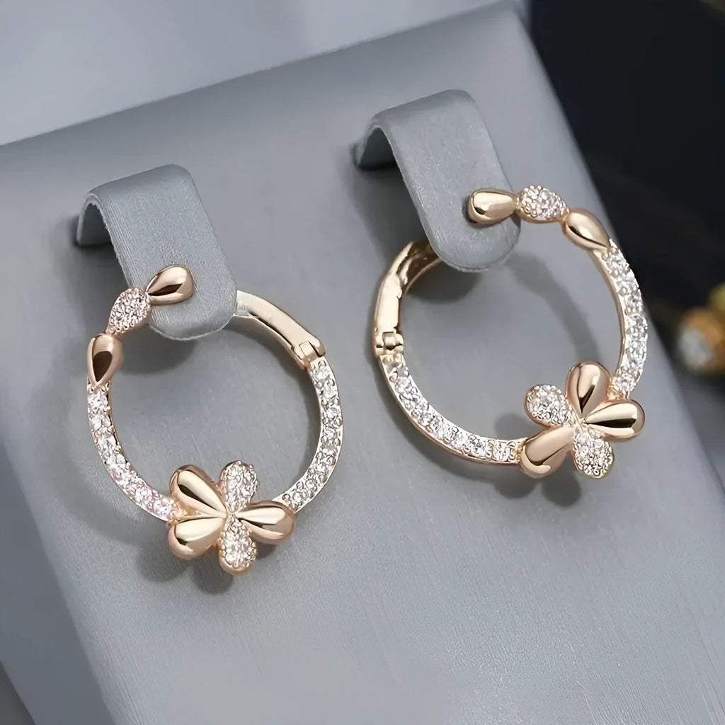 A pair of round geometric ring earrings for women with a copper base and electroplated finish.