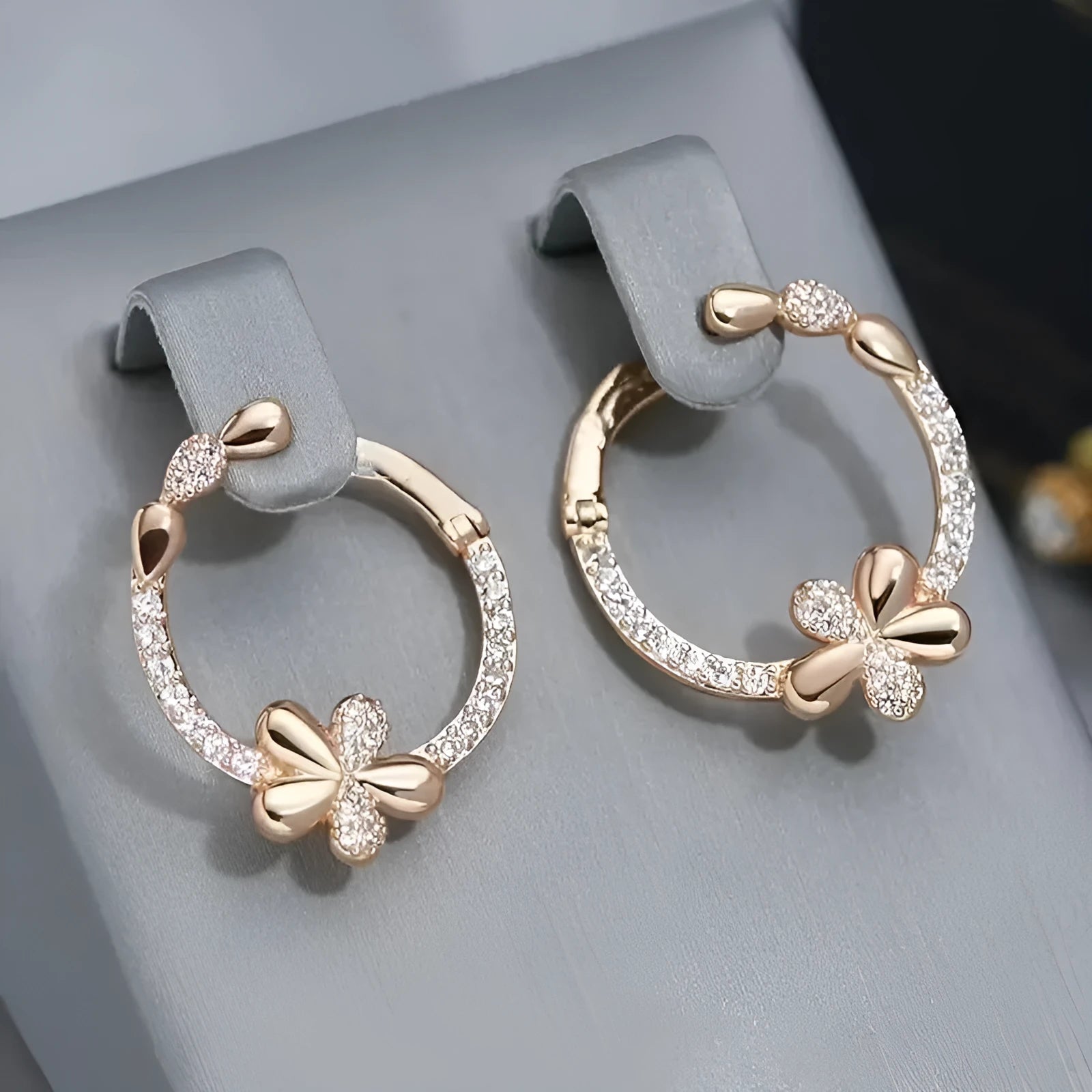 A pair of round geometric ring earrings for women with a copper base and electroplated finish.
