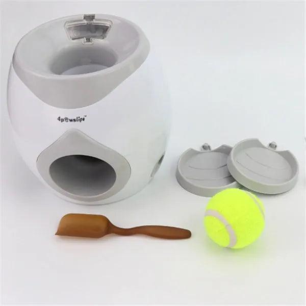 White plastic tennis food reward machine for interactive dog training with snack dispensing