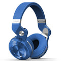 Black Bluetooth headset with in-line controls and a subwoofer, shown in a head-mounted position.